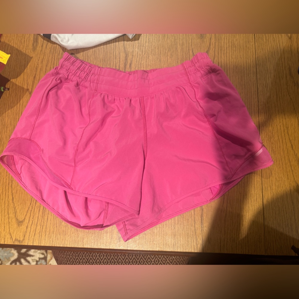 Neon pink size ten Lulu four inch Hotty hot shorts
